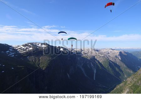 Skydiving over beautiful Norway. Clouds, sun and sky