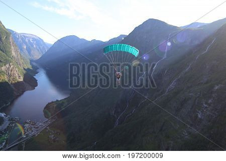 Skydiving over beautiful Norway. Clouds, sun and sky