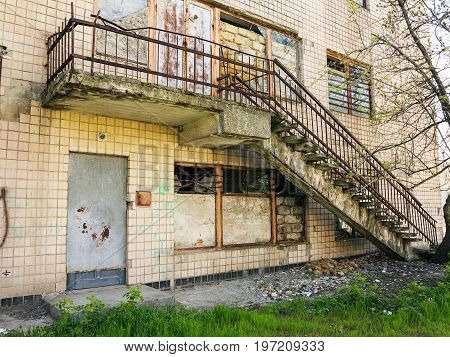Panoramic View Of The Street With Decaying Houses In A Poor Neighborhood. Ruined Building After A Na