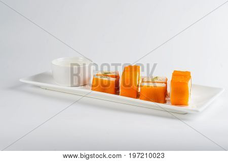 Dessert Maki Sushi - Roll With Various Fruit In Rice Pudding And Coconut Flakes