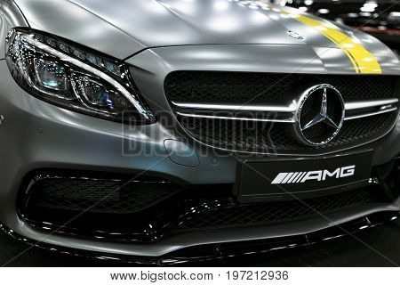 Sankt-Petersburg Russia July 21 2017: Front view of a Mercedes Benz C 63s coupe 2017. Front Headlight. dark Matt color .Car exterior details. Photo Taken at Royal Auto Show July 21
