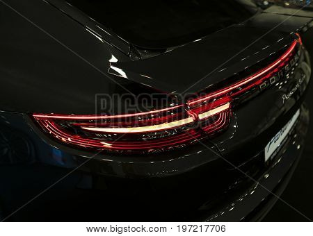 Sankt-Petersburg Russia July 21 2017: Back view of a Porsche Panamera Turbo 2017. Rear light .Car exterior details. Photo Taken at Royal Auto Show July 21