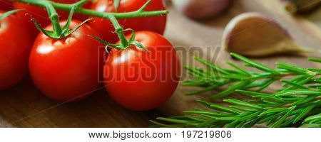Healthy Food drink diet Italian lifestyle: Mediterranean vegetable herbs spice healthy cuisine. Italian herb rosemary, garlic, red cherry tomato.