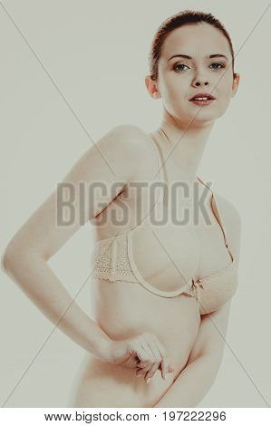 Woman in bra lace lingerie taking care of her breasts female chest in underwear toned image