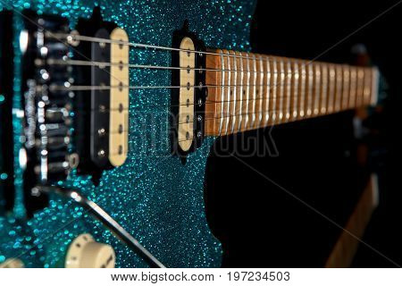 Glam rock guitar. Stunning electric guitar with beautiful glitter finish. Loud christmas party music image.