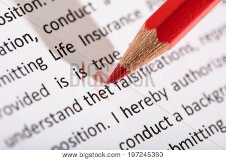 Rectifying That Word With Red Colored Pencil On Manuscript