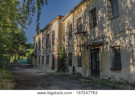 Old Ruins Of Buildings In Medvedice Village In Summer Sunny Evening