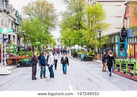 Montreal Canada - May 26 2017: People walking on Saint Denis street in Montreal's Plateau Mont Royal in Quebec region