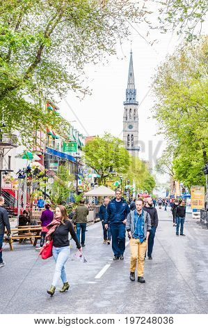 Montreal Canada - May 26 2017: People walking on Saint Denis street in Montreal's Plateau Mont Royal in Quebec region