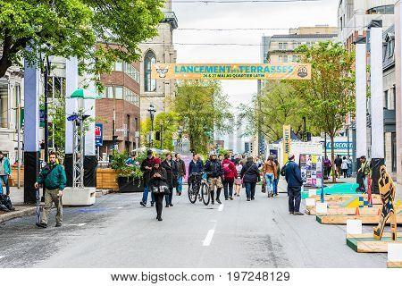 Montreal Canada - May 26 2017: People walking on Saint Denis street in Montreal's Plateau Mont Royal in Quebec region