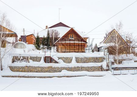 Berdsk Novosibirsk oblast Siberia Russia - January 11 2017: winter steep to the river with the buildings of a holiday village