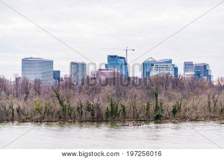 Washington Dc, Usa - March 20, 2017: People Rowing On Potomac River On Boat With Skyline Of Arlingto