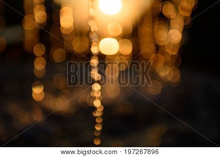 Blurred water splash in sunset light background