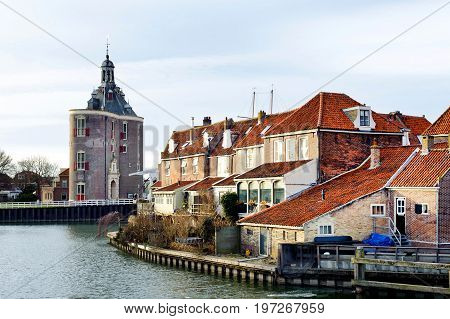Beautiful view on castle and old houses near the river in Enkhuizen city of Netherlands background