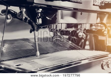Closeup High Quality Metal Coffee Machine Head Shot For Barista Cafe Vintage Color Tone.