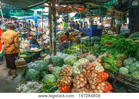 Lampang. Thailand - July 04 2016: People sale raw food product from around the country in every morning at the market in rurul countryside in Asia Thailand.