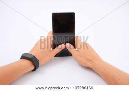 Fitness Bracelet And Phone In Female Hands On White