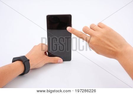 Fitness Bracelet And Phone In Female Hands On White