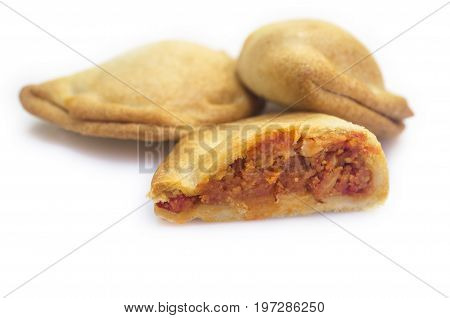 Typical spanish empanadillas or tuna small turnover. Isolated over white background