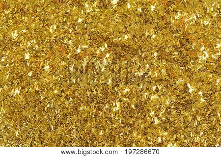 Golden glitter texture, abstract background. High resolution photo