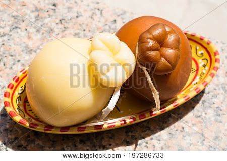 Traditional Italian Hard Cheese Provolone Of Caciocavallo, White And Smoked.