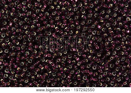 Background of black and red seed beads. High resolution photo.