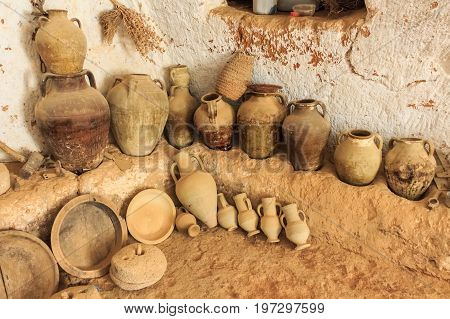 Ceramic pots and jars in interior of residential caves of troglodyte in Matmata, Tunisia, Africa