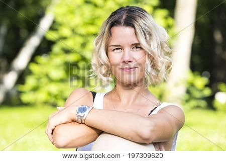 Portrait of a girl in a summer park outdoors