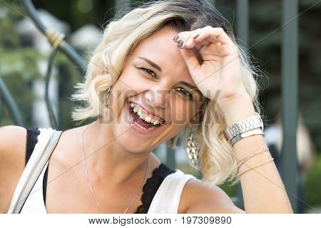 Portrait of a girl in a summer park outdoors
