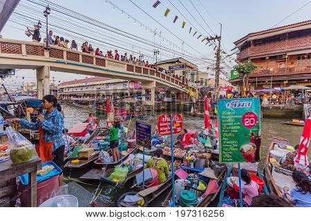 SAMUT SONGKHRAM, THAILAND - JANUARY 25, 2015: Trader's boats in Amphawa floating Market 110 km from Bangkok most famous floating market and cultural tourist destination in Amphawa Thailand.