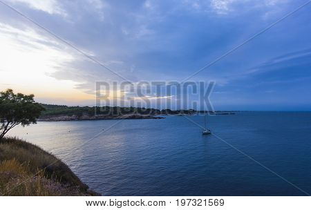 Blue hour in quiet beach of l'Escala, Costa Brava, Spain. Mediterranean Sea