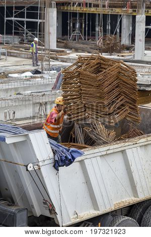 Crane Lifter Handling Bundles Of Angled Rebar Loading
