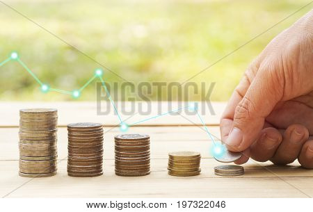 hand staced on coin deposit of save for prepare in the future. save moneon table banking concept for background.concept in grow and walk step by step for success in business