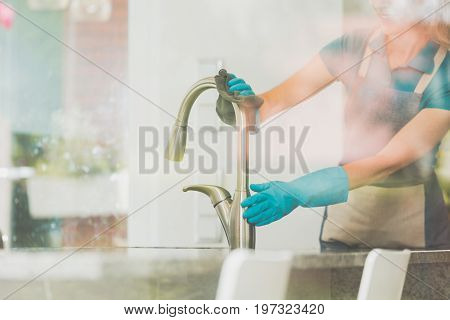 Girl Cleans The Kitchen