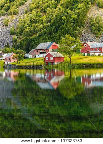 Norwegian country house hytte in the mountains. Beautiful coastline fjords landscape in Norway Scandinavia Europe