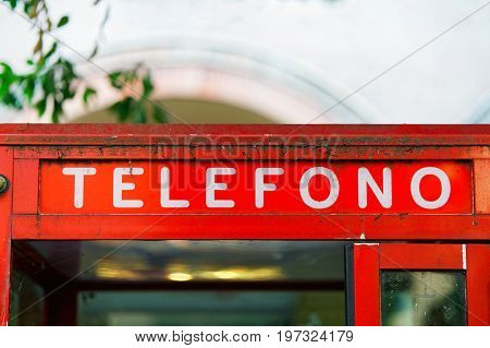 Fragment of red telephone box in Bologna Italy