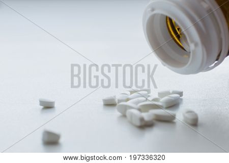 Oval Pills Spilling And Dropped Out Of Pill Bottle
