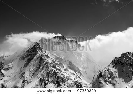 Black And White View On Snow Winter Mountains In Clouds