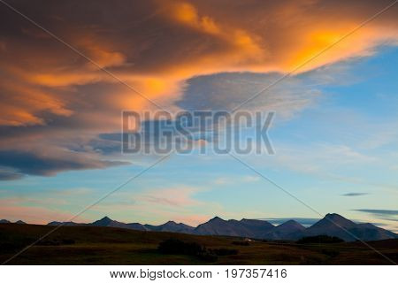 Sunset over ranch country  and the Rocky Mountains in Southern Alberta, Canada