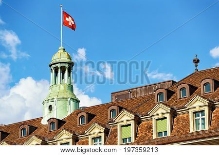 Tower With Swiss Flag And Roof Covered With Tiles Bern