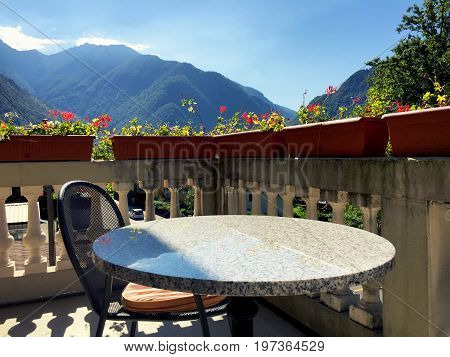Table And Chair At The Balcony Veranda In Aurigeno