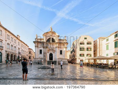 People On Square And St Blaise Church In Stradun Dubrovnik