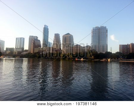 Austin, Texas city skyline reflected in Lady Bird Lake.