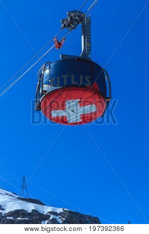 Mt. Titlis Switzerland - May 28 2017: a gondola of the Rotair cable car view from the station on the top of the mountain. Rotair gondolas make a 360 degrees turn during.