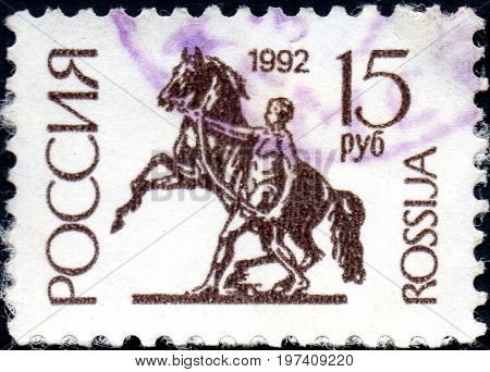 UKRAINE - CIRCA 2017: A postage stamp printed in Russia shows The Horse-tamer statue St. Petersburg. Series 1st Definitive Issue circa 1992