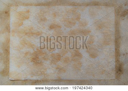 Grungy brown paper background with many stains