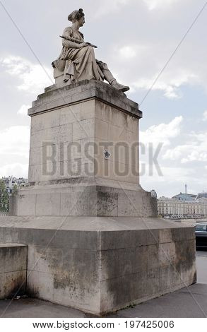 ParisFrance- April 29 2017: Seine Statue (Louis Petitot) on Pont du Carrousel (Carrousel Bridge)
