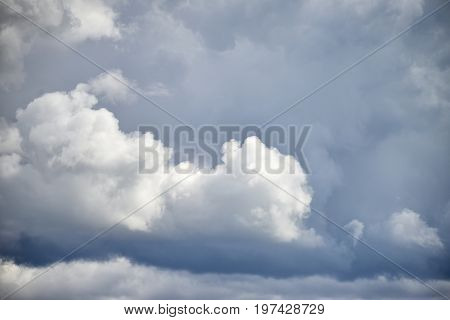 Dramatic Cumulus Clouds With High Level Cirrocumulus Clouds For Use As Background