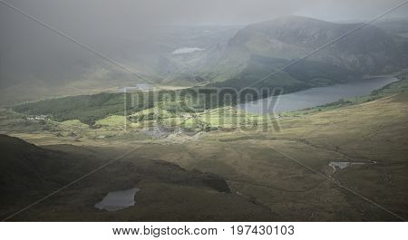 Landscape View Of Llyn Cwellyn And Moel Cynghorion In Snowdonia Shrouded In Fog And Cloud
