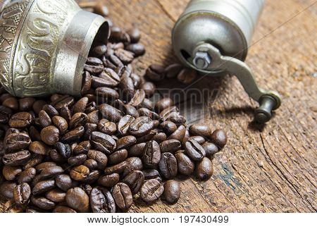 Small coffe grinder with coffee beans close up